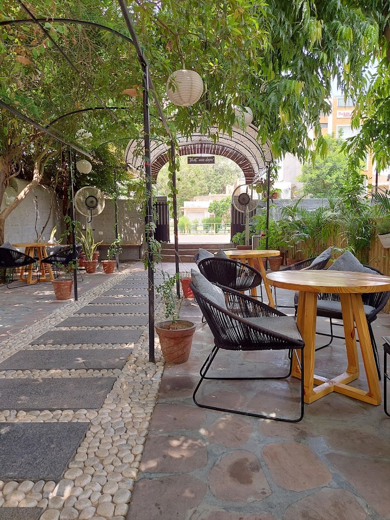 Wooden  & Metal furniture with upholstery, rope work and a marble tile top, complemented by caning work, adds a distinctive aesthetic to a restaurant's ambiance.