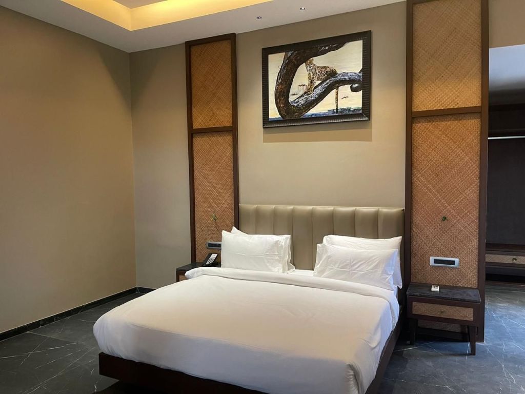 Wooden furniture with upholstery work and a marble tile top, complemented by caning work, adds a distinctive aesthetic to a restaurant's ambiance